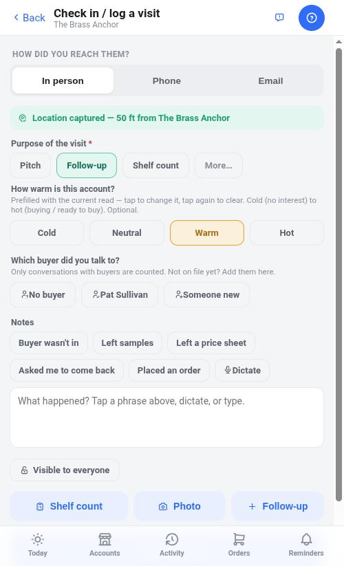 A check-in in progress: a green bar reading "Location captured — 50 ft from The Brass Anchor", one-tap purpose chips, a warmth rating, the buyer, and canned notes.